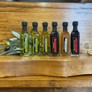 OV Harvest Italian Sampler featuring bottles of Extra Virgin Olive Oil, Garlic Olive Oil, Tuscan Olive Oil, Sicilian Lemon Balsamic, Fig Balsamic & Traditional Balsamic