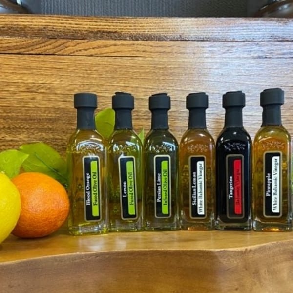 OV Harvest citrus sampler featuring Blood Orange Olive Oil, Eureka Lemon Olive Oil, Persian Lime Olive Oil, Tangerine Balsamic, Pineapple Balsamic & Sicilian Lemon Balsamic