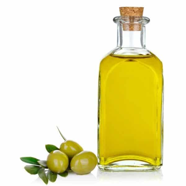 photo of jar of olive oil with olives representing picual extra virgin olive oil