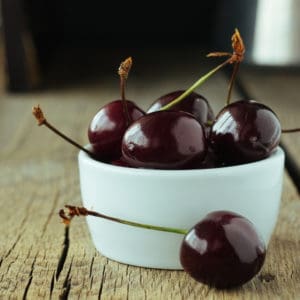 photo of black cherries in bowl representing black cherry balsamic vinegar