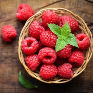 photo of raspberries in basket representing cascadian wild raspberry white balsamic vinegar