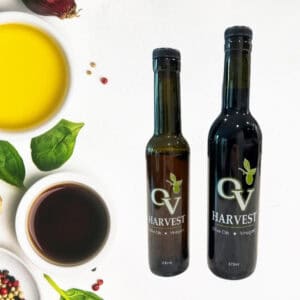 Bowl of balsamic vinegar, bowl of olive oil, bowl of peppercorns and OV Harvest balsamic vinegar bottles representing Traditional Style Balsamic Vinegar