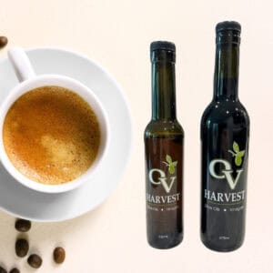 Cup of espresso, coffee beans and OV Harvest balsamic vinegar bottles representing Espresso Balsamic Vinegar