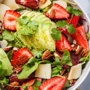Strawberry Salad with avocado, herbs, nuts, and cheese.